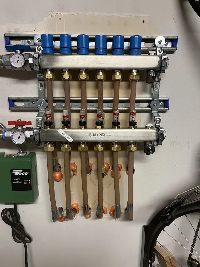 Plumber performing Water Heater Repair at a residential property in Hampton